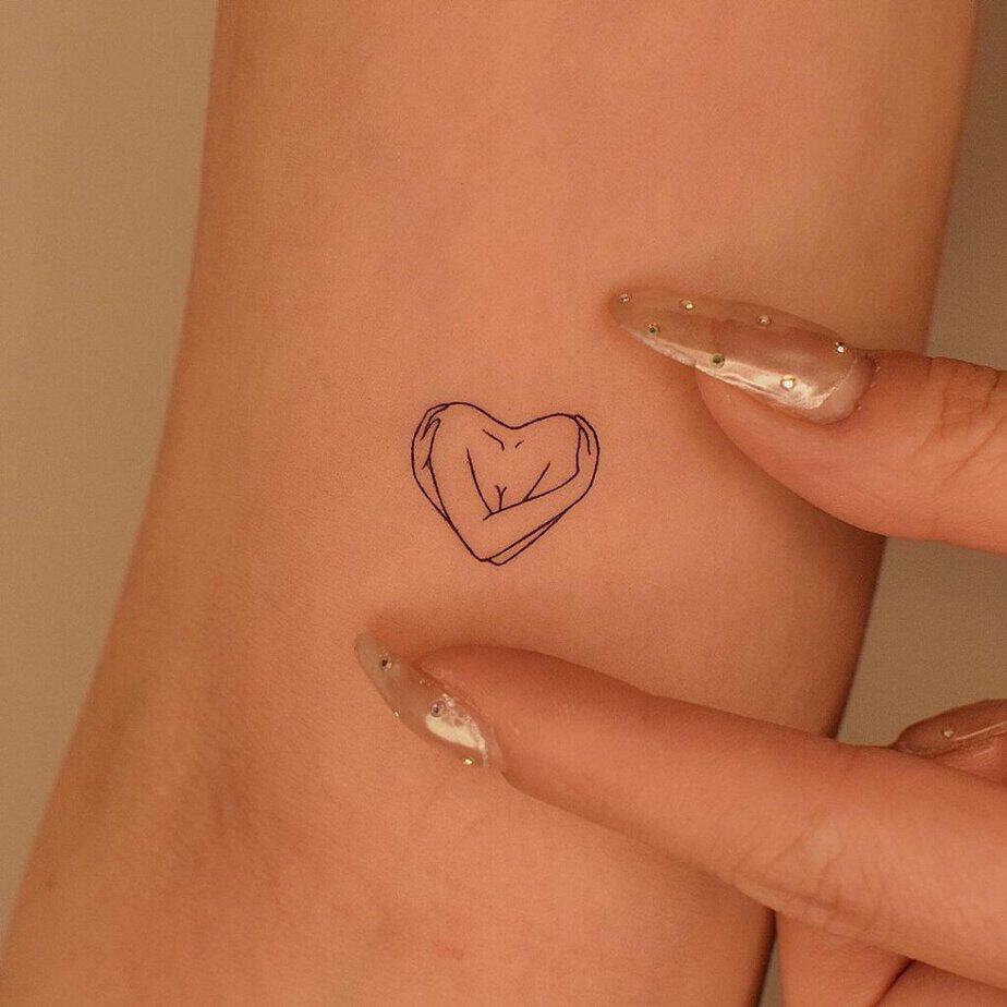 12. A heart hug tattoo 