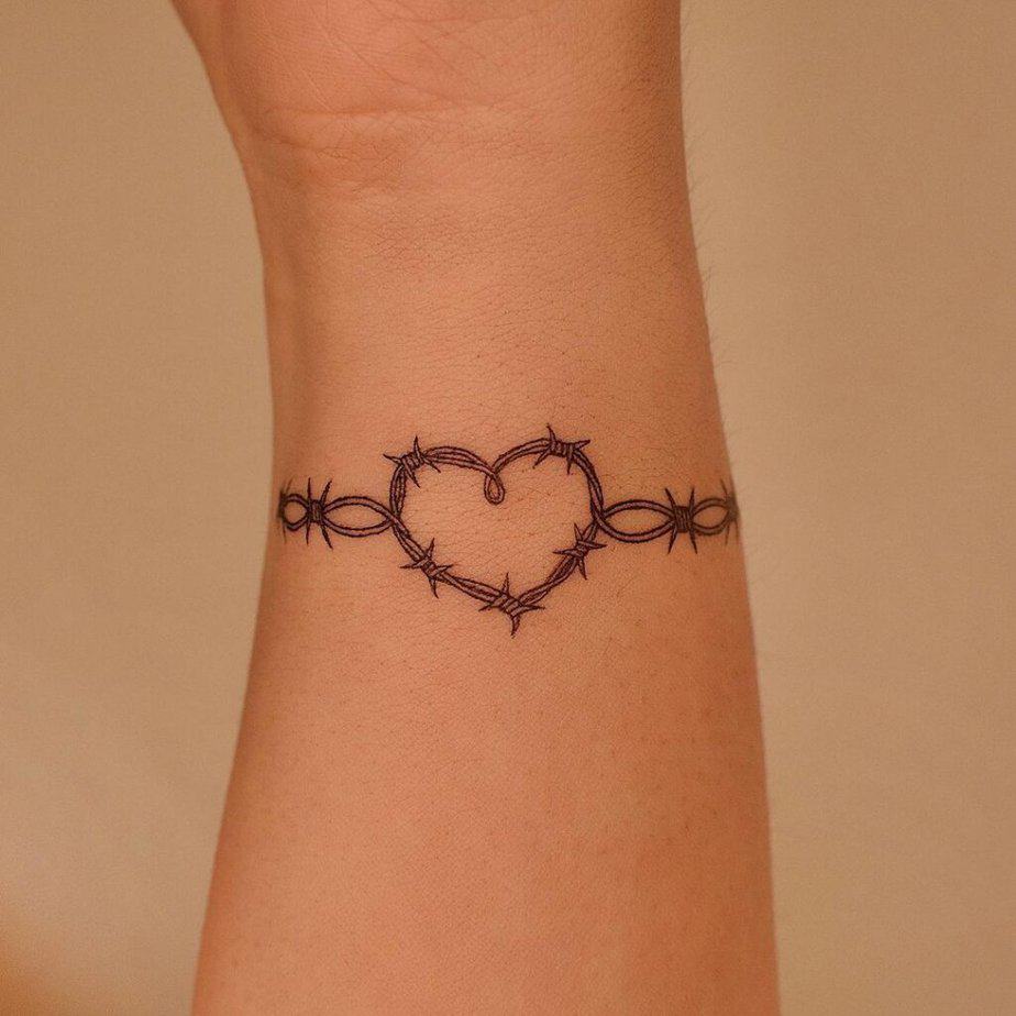 14. A barbed wire heart tattoo 
