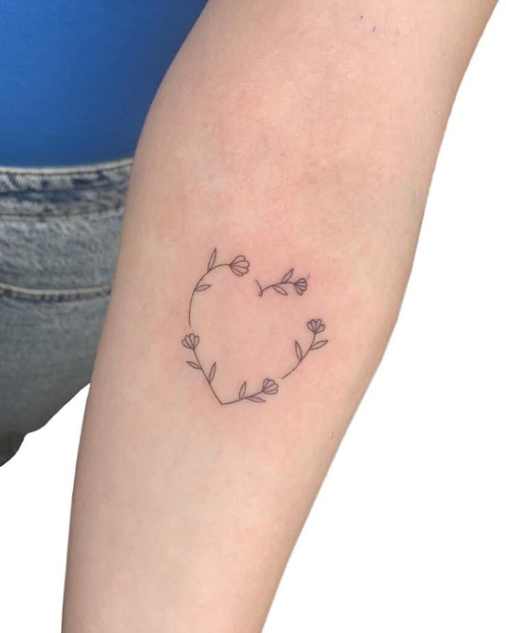 15. A flower heart tattoo 