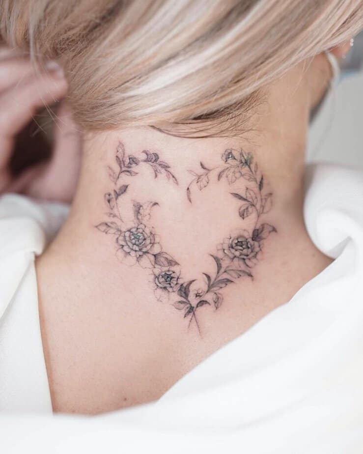 19. A romantic heart tattoo on the neck