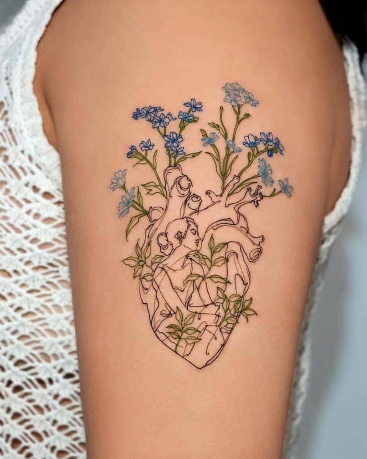 4. An intricate heart tattoo with flowers 