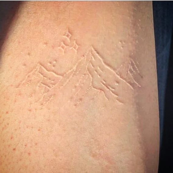 Mesmerizing mountain tattoo