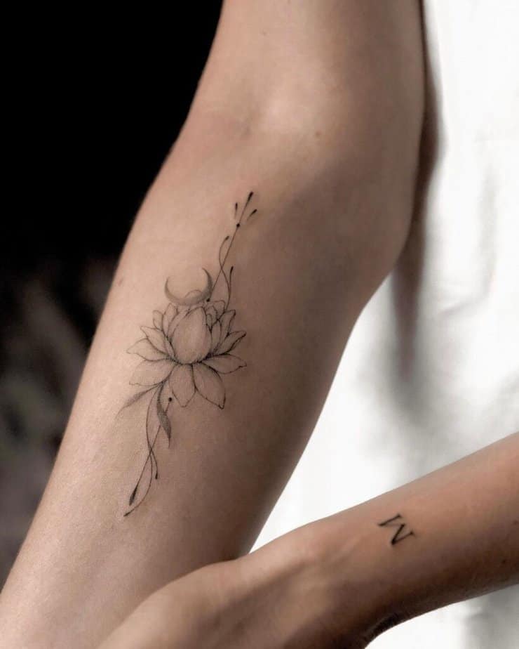 Minimalistic forearm floral tattoo