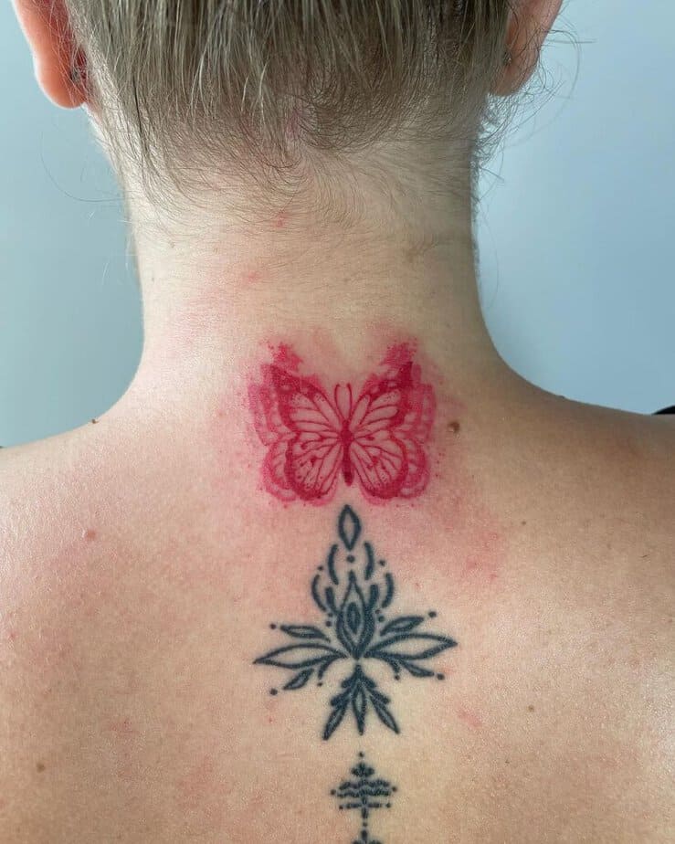 11. A tattoo of a flattering butterfly on the back