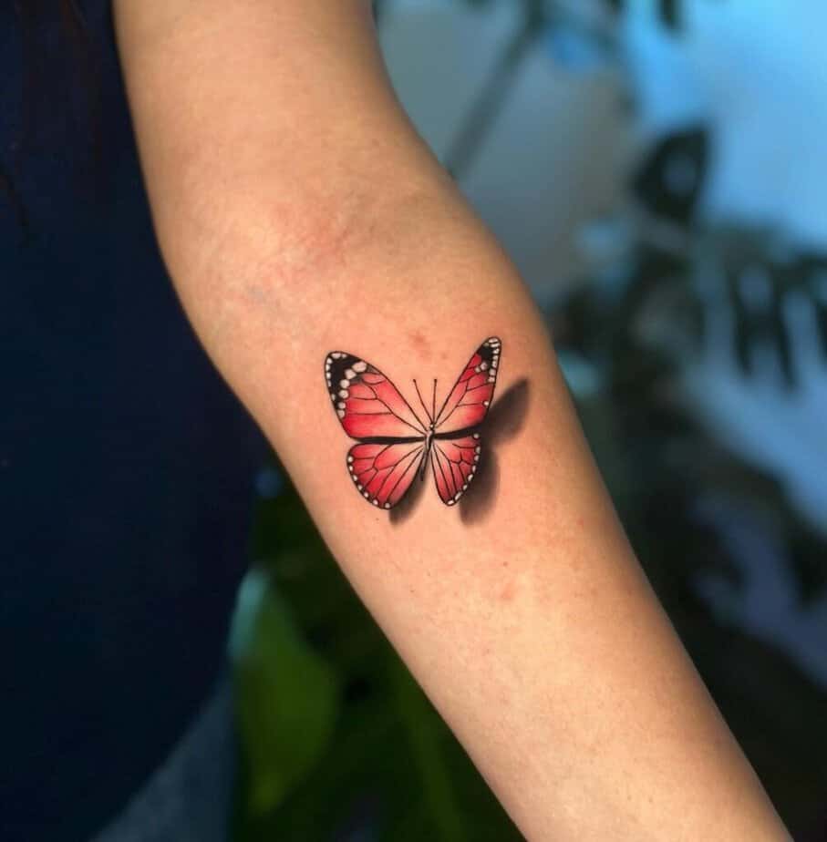 6. A 3D red butterfly tattoo 