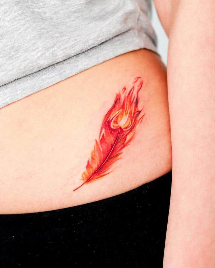 9. A tattoo of a feather on fire 