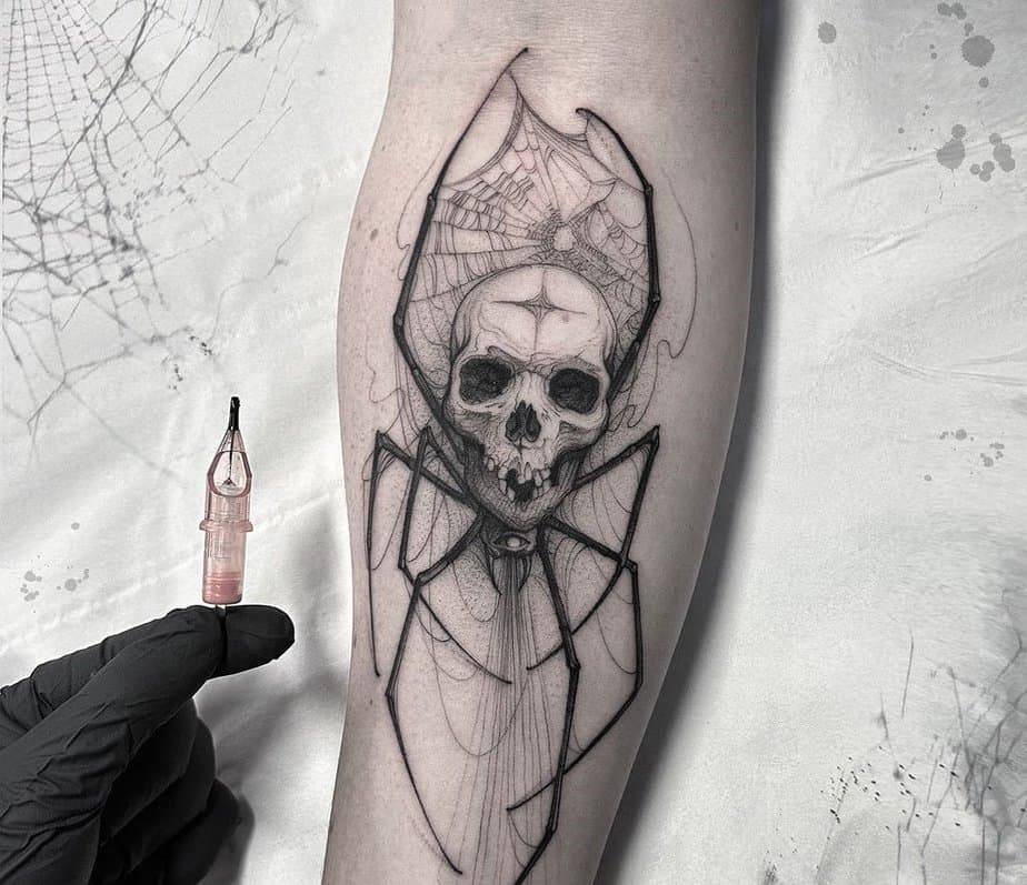 Skull and spider tattoo