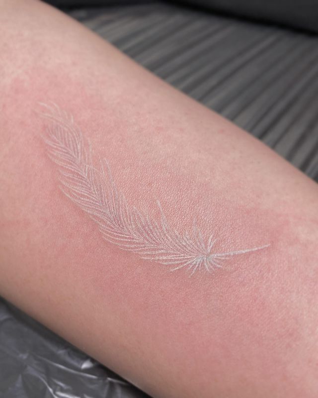 Stunning feather white tattoo