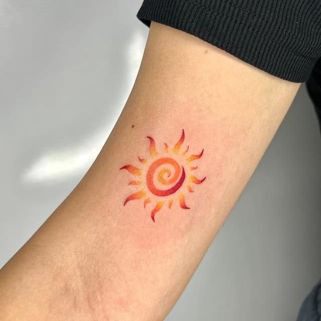 Swirling sun tattoo 1