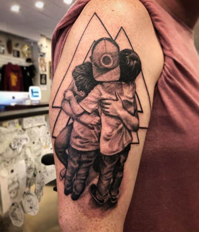 19. Touching father and son tattoo
