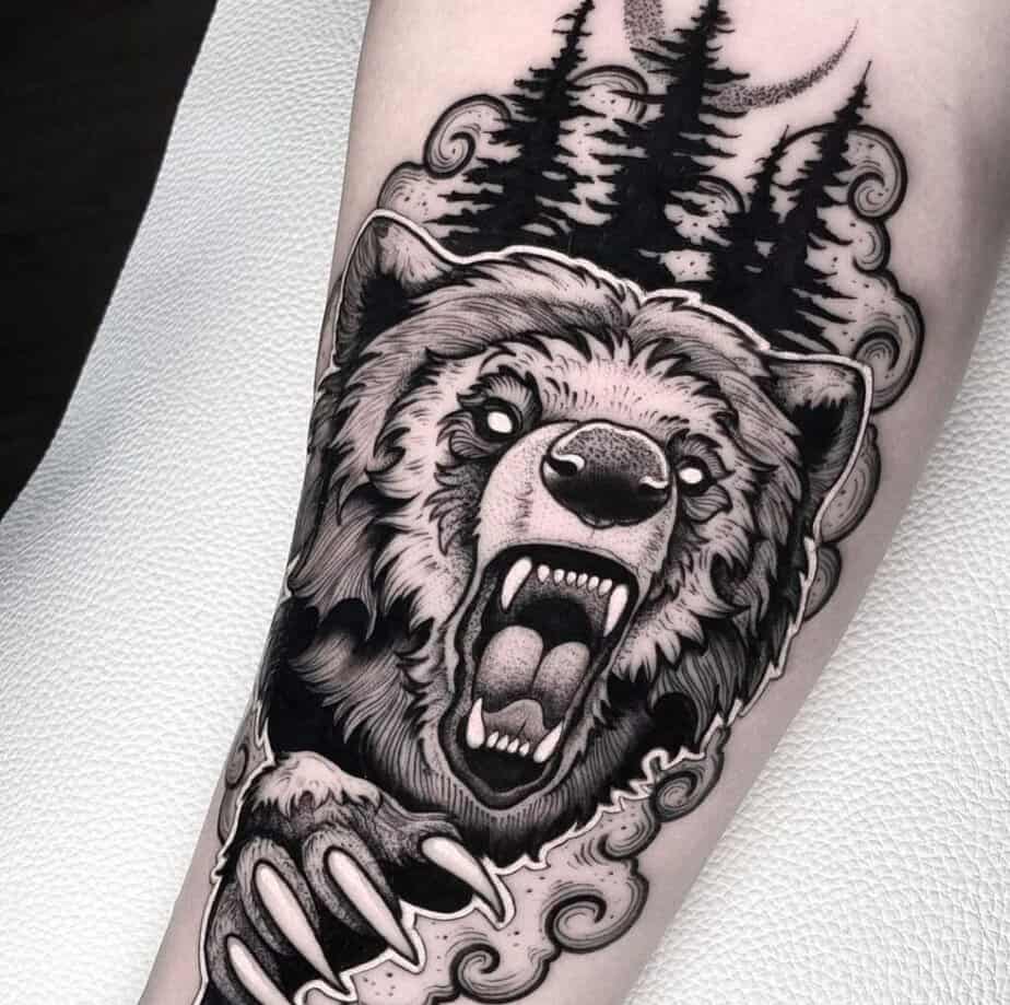 8. A black and gray bear on the forearm