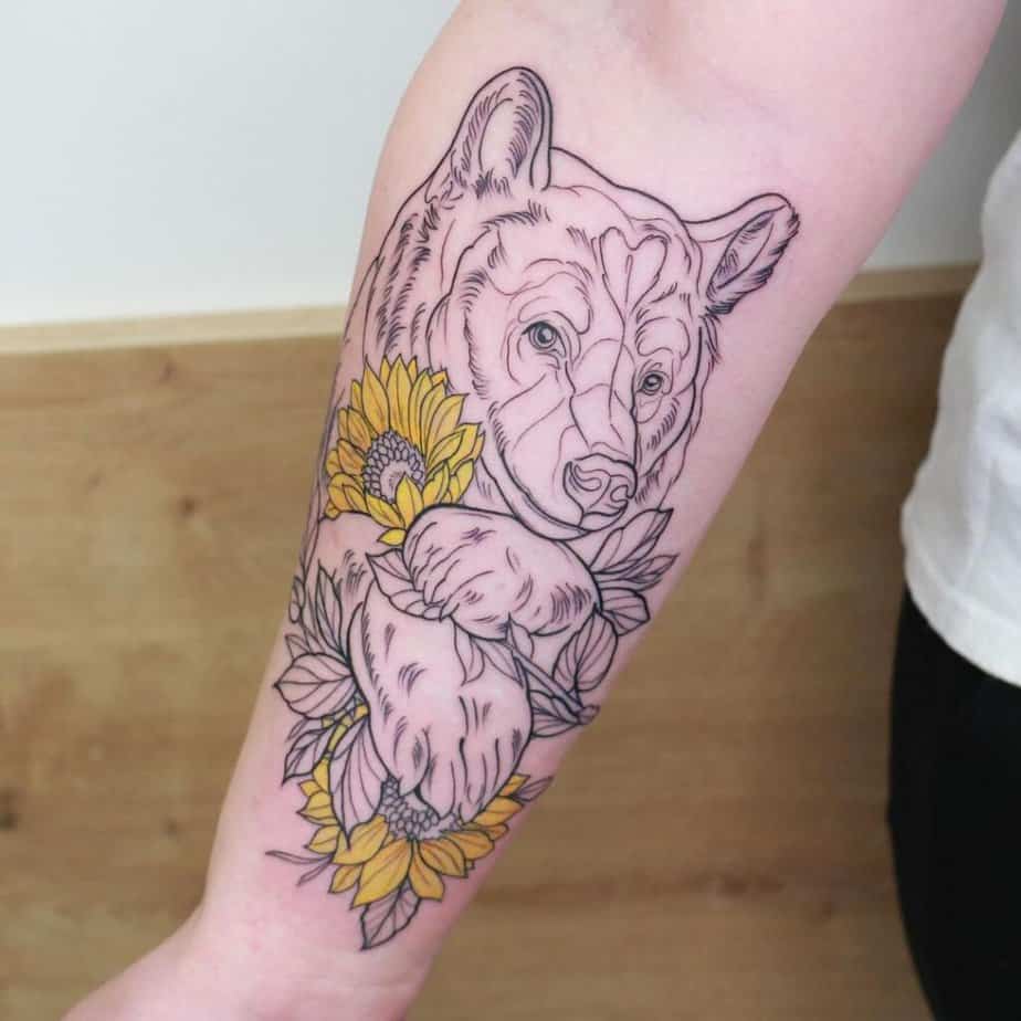 15. A linework bear with sunflowers