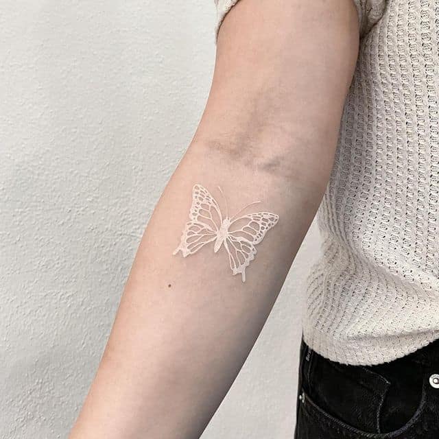 White butterfly tattoo