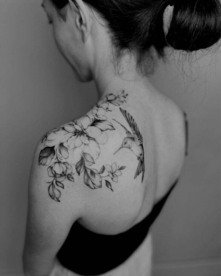 Floral shoulder tattoo with birds