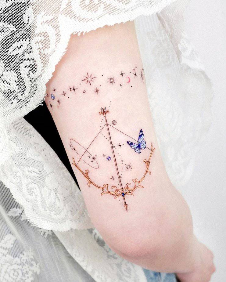 Colorful bow and arrow tattoo
