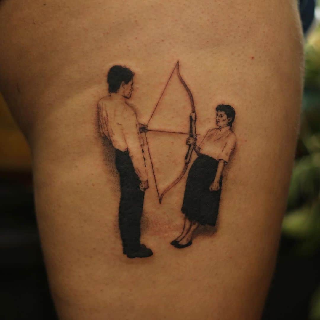 Unique bow and arrow tattoo
