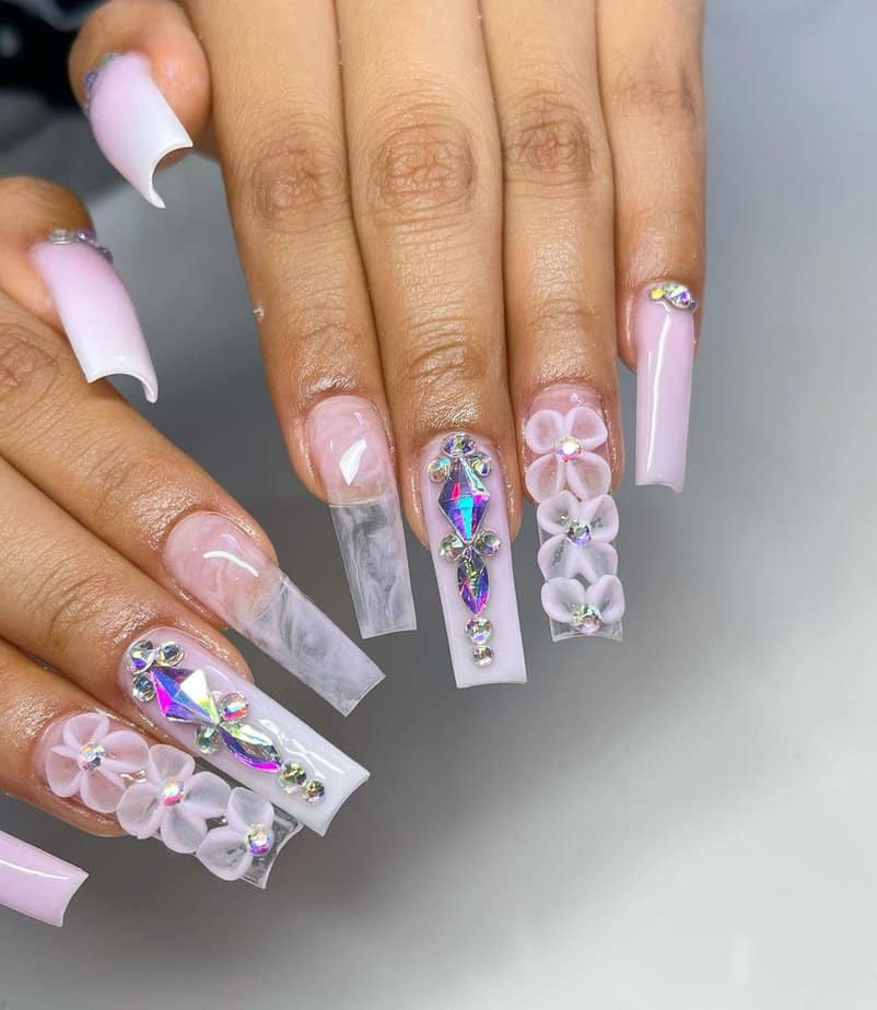 24. Baby pink nails with flowers and crystals