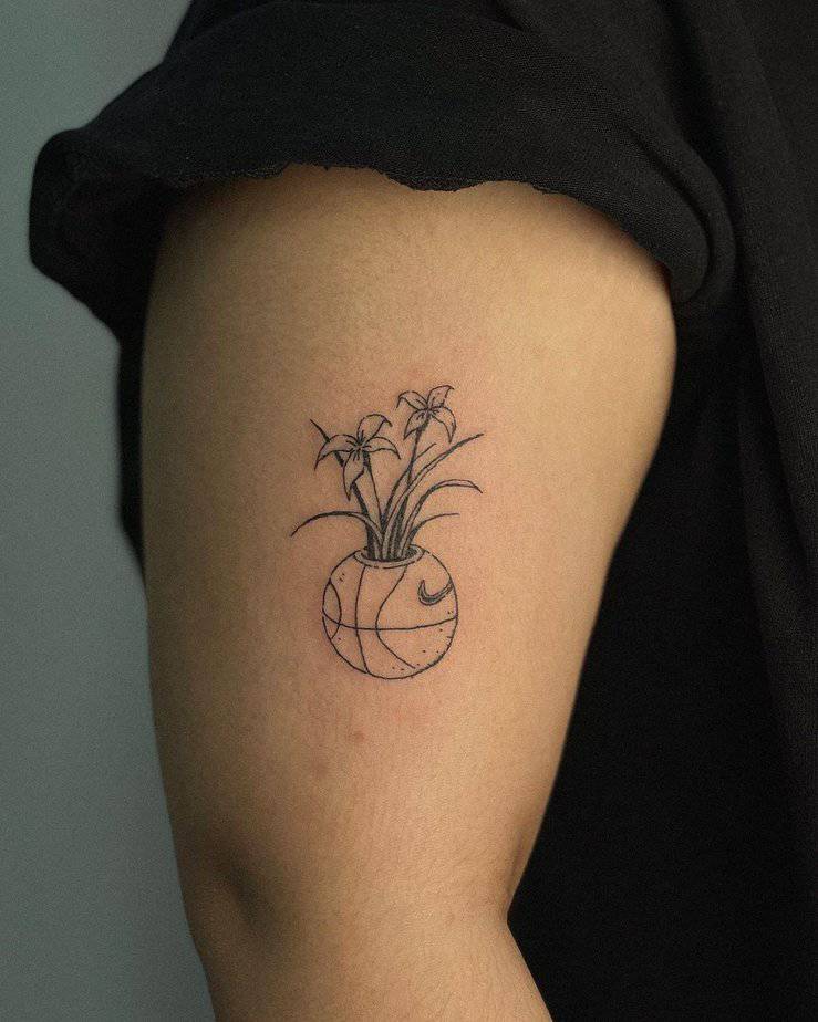 36. Floral basketball tattoo