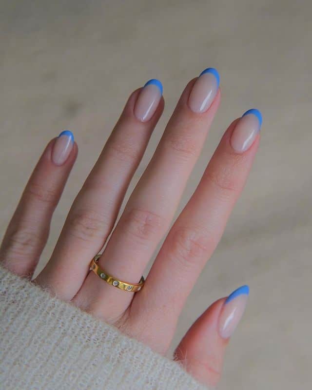 A vibrant blue French mani