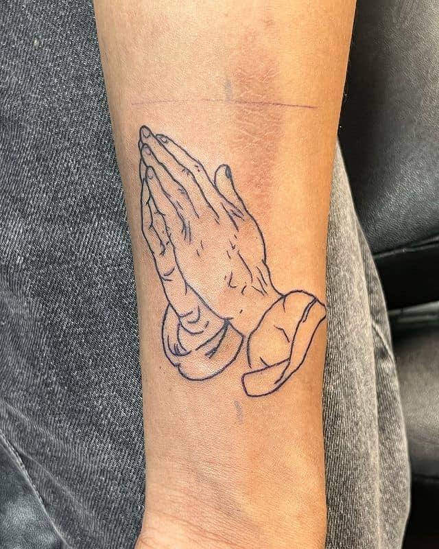 Fine line praying hands tattoo