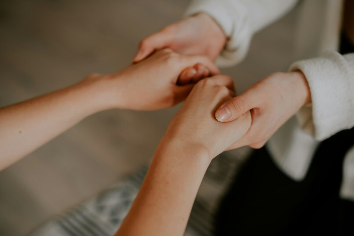 Two people holding hands.