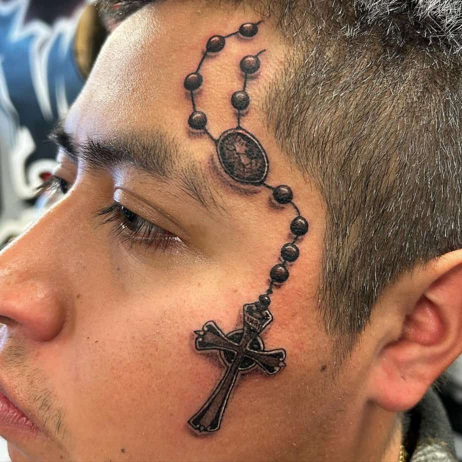 Face rosary tattoo