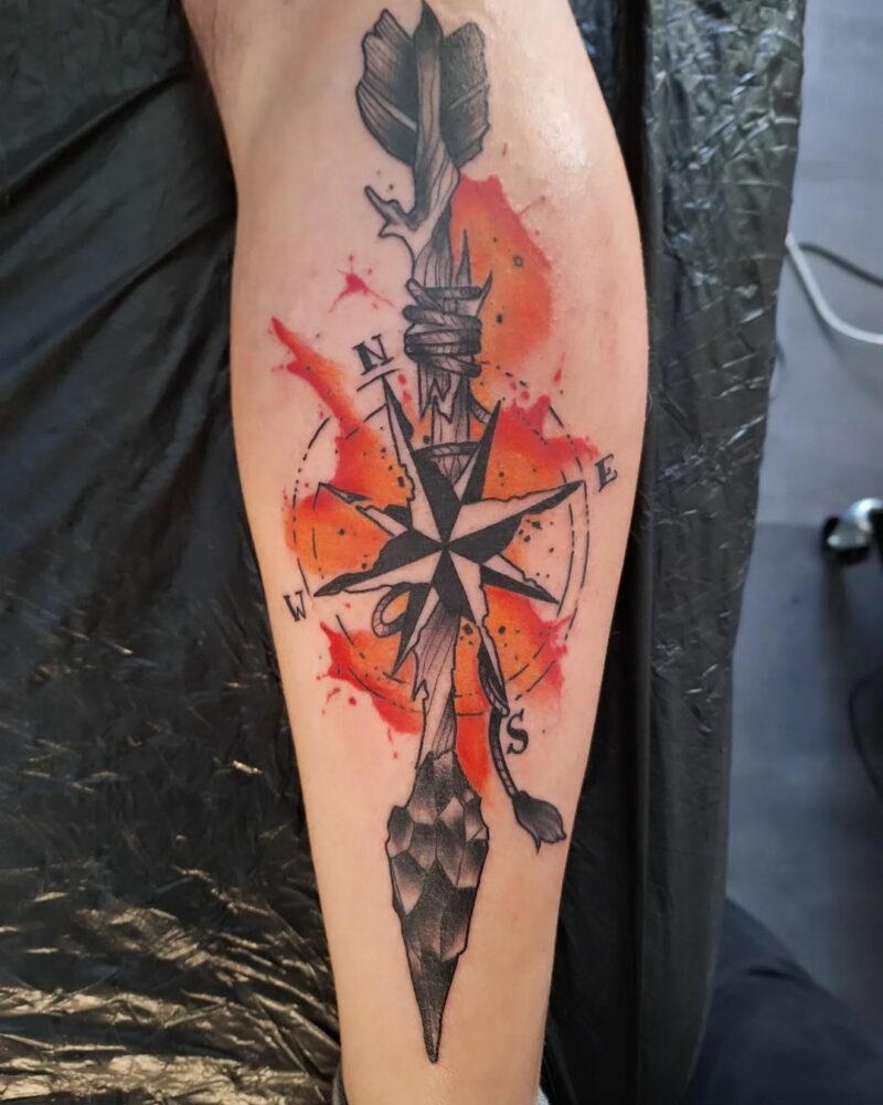 Fiery arrow tattoo