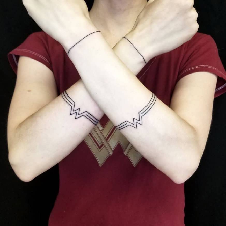 Matching bracelet tattoos