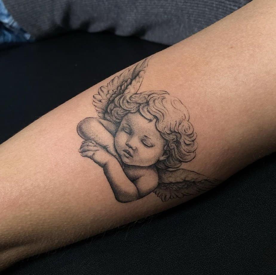 Sleeping cherub tattoo