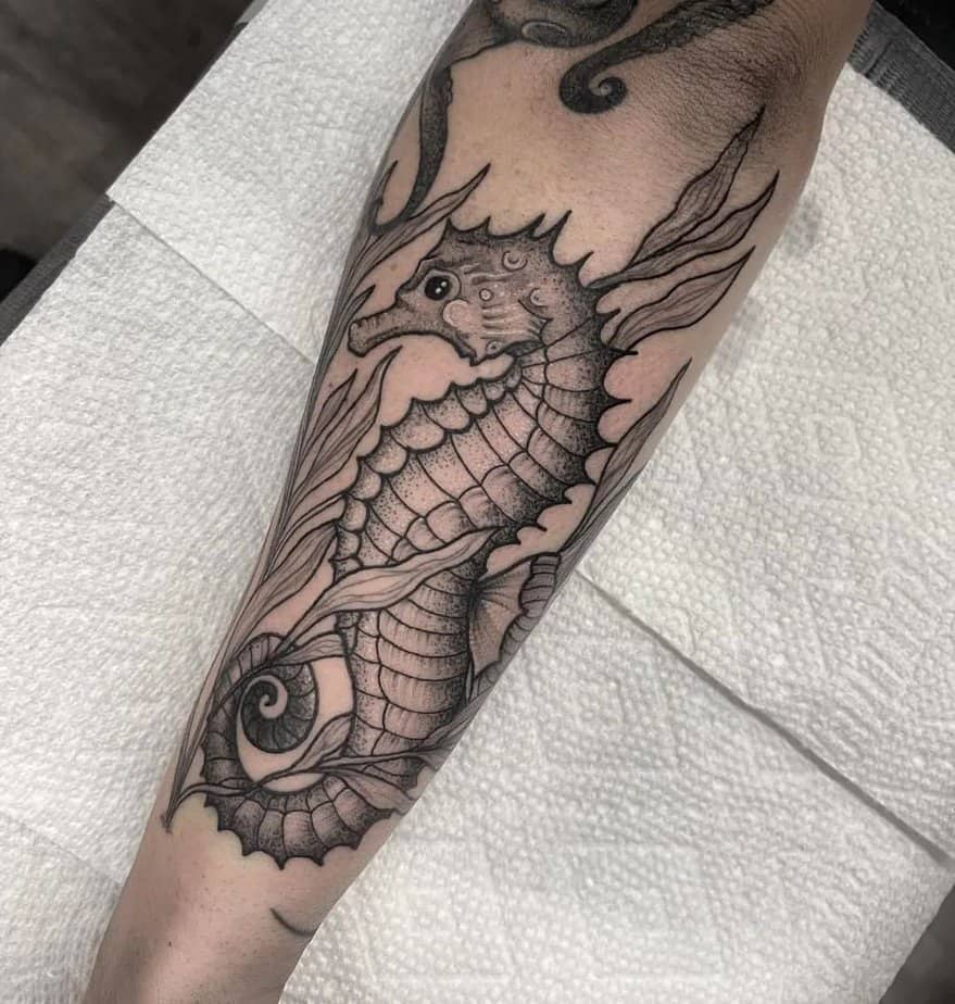 2. Forearm seahorse with seaweed tattoo