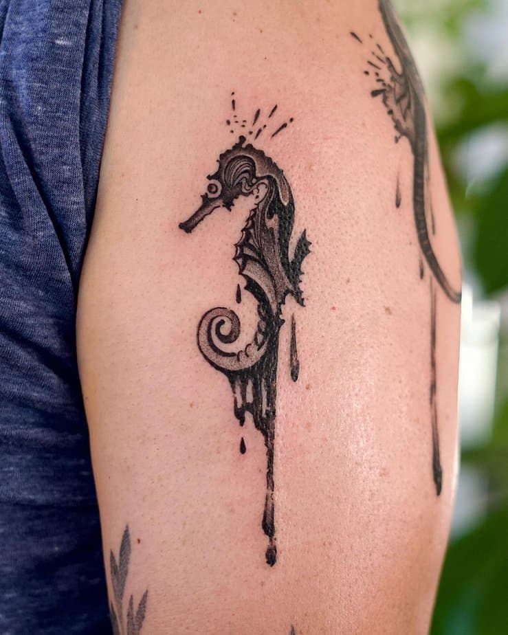 20. Dripping black seahorse tattoo