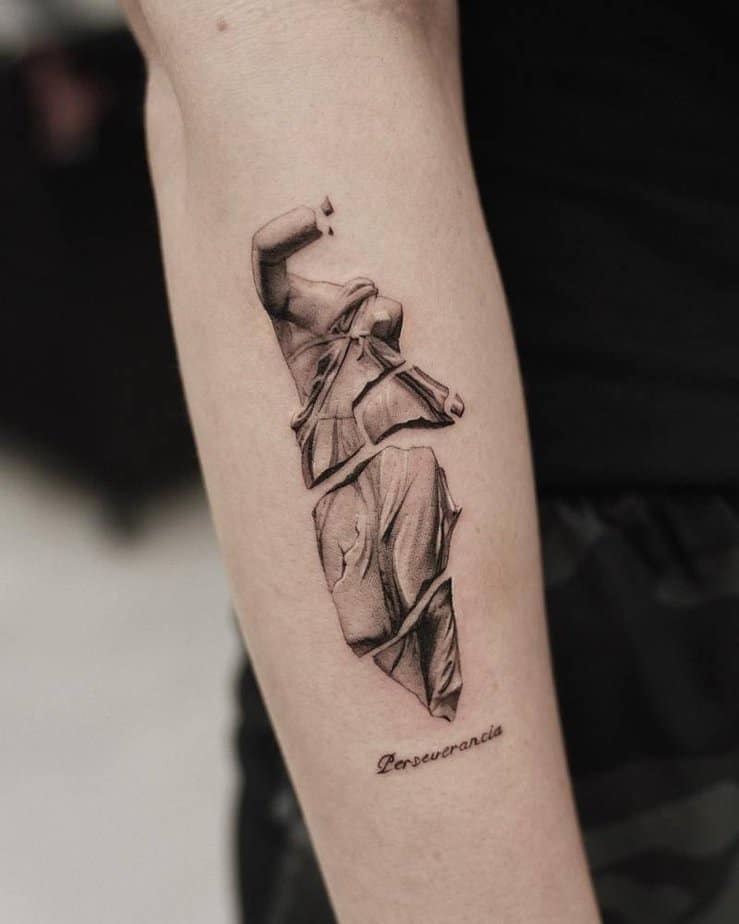 Broken sculpture tattoo