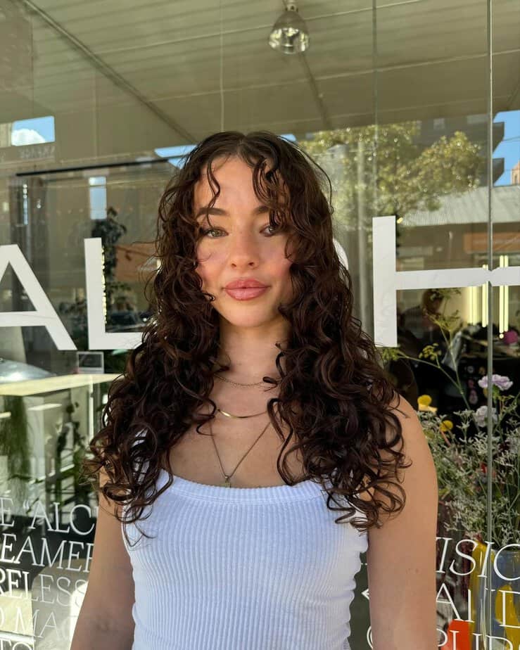 Curly hair with curtain bangs