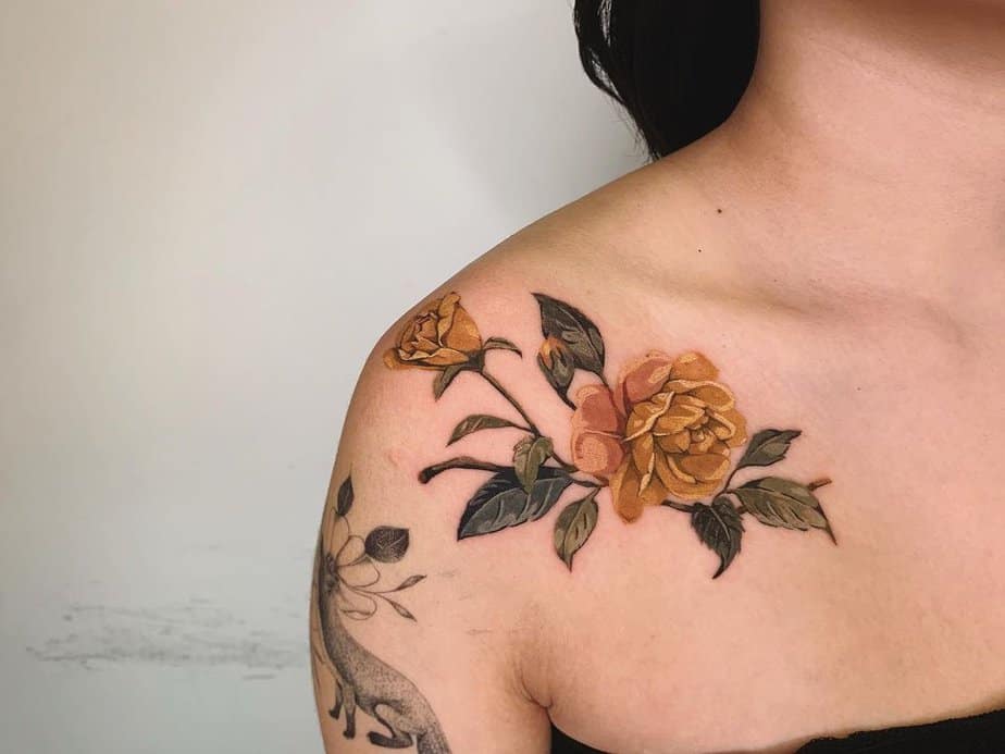 Delicate yellow rose tattoo