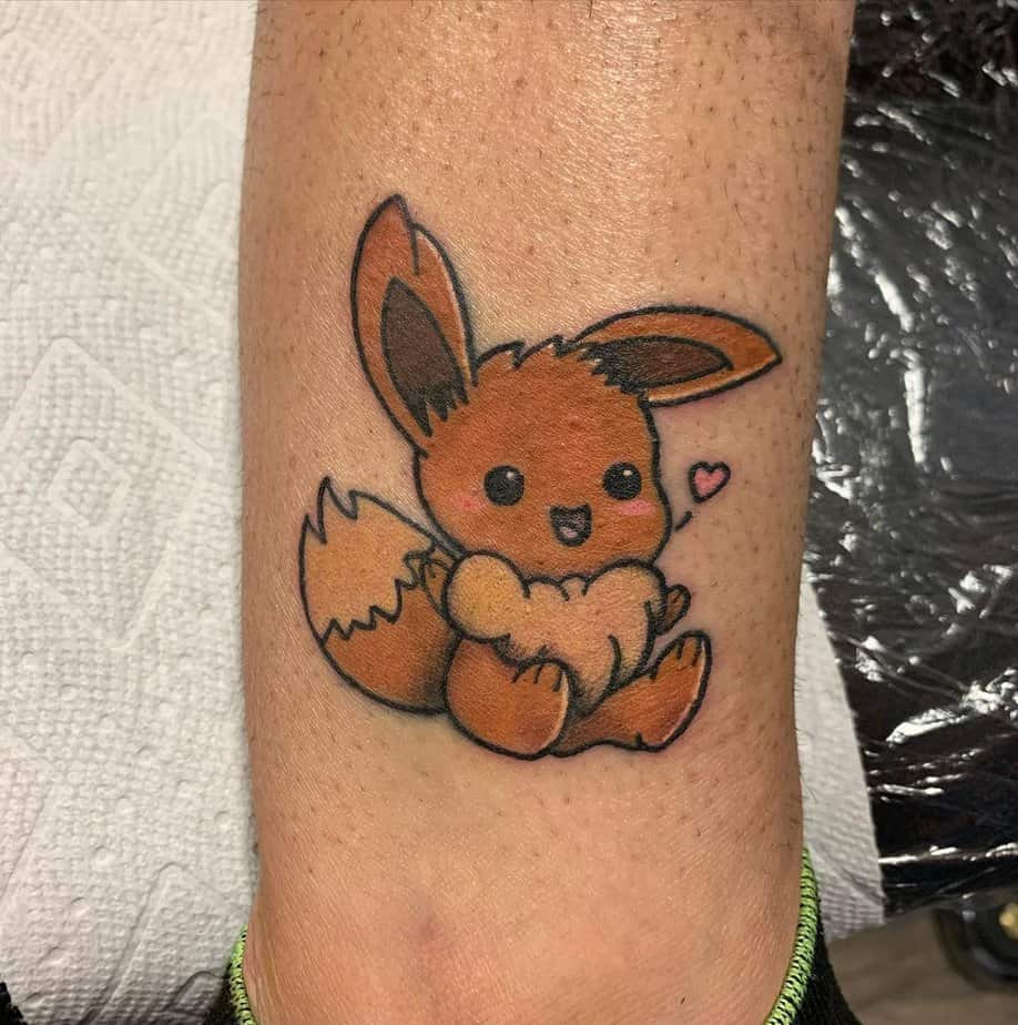 Eevee tattoo with a tiny heart