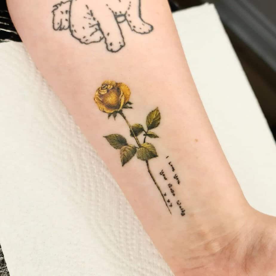 Miniature yellow rose tattoo