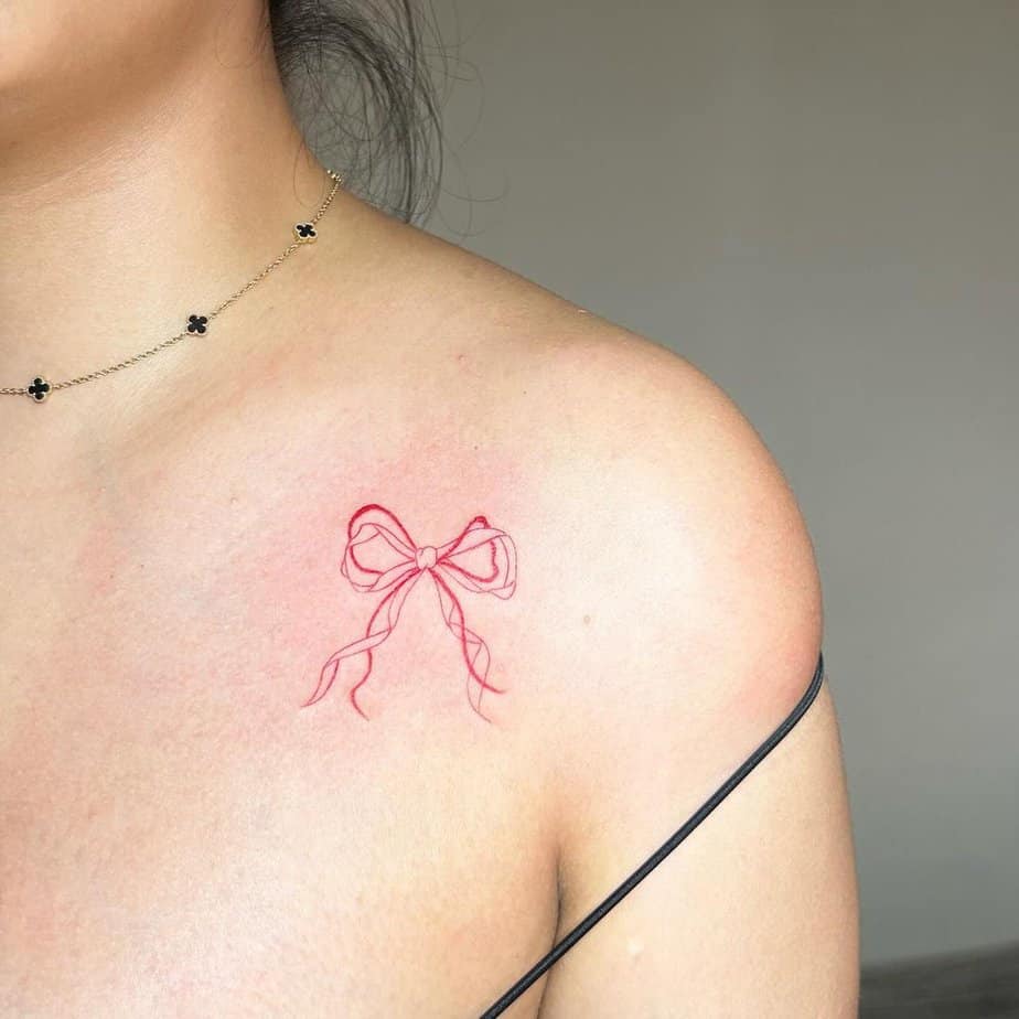 Red bow tattoo