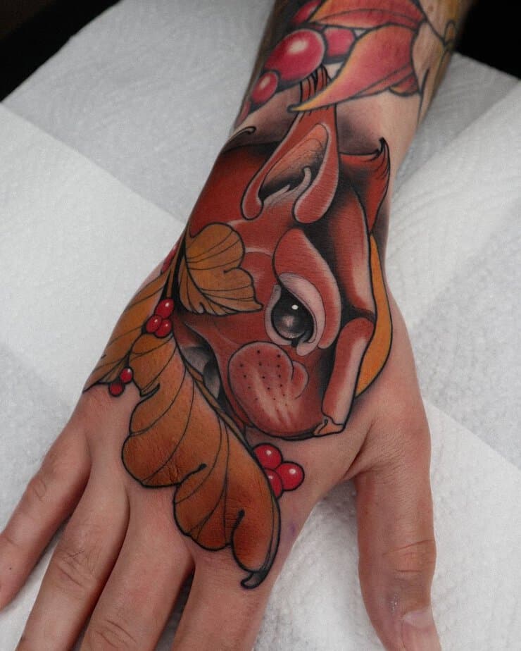 Squirrel hand tattoo