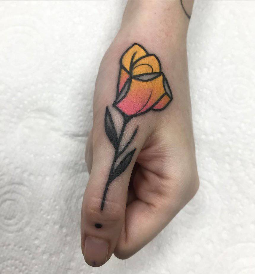 Yellow rose finger tattoo