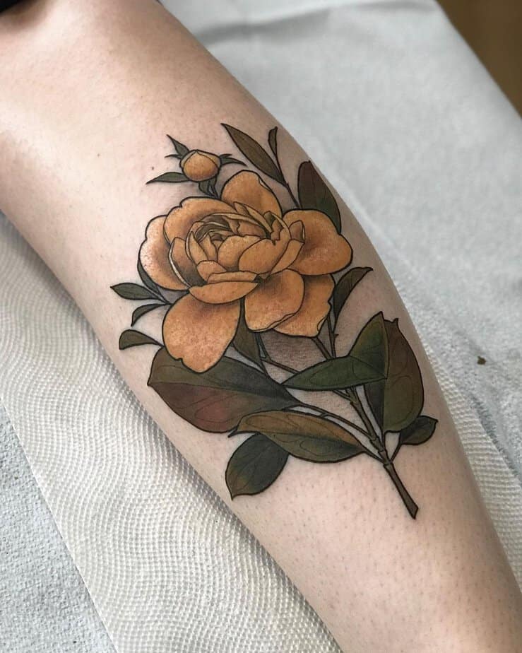 Yellow rose tattoo on the forearm