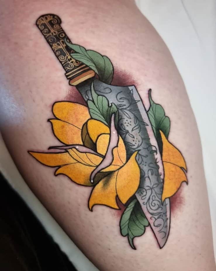 Yellow rose with a dagger