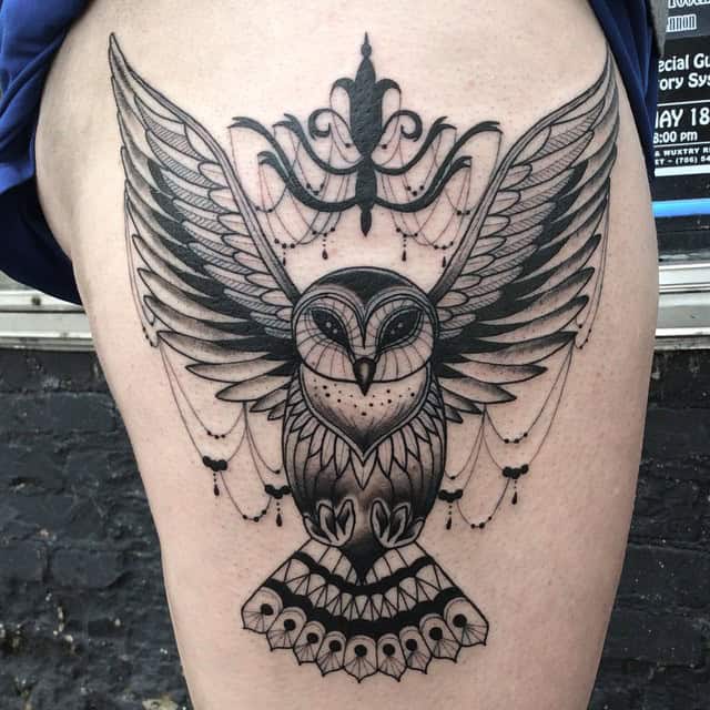 14. Owl and chandelier tattoo with a symbolic touch 1