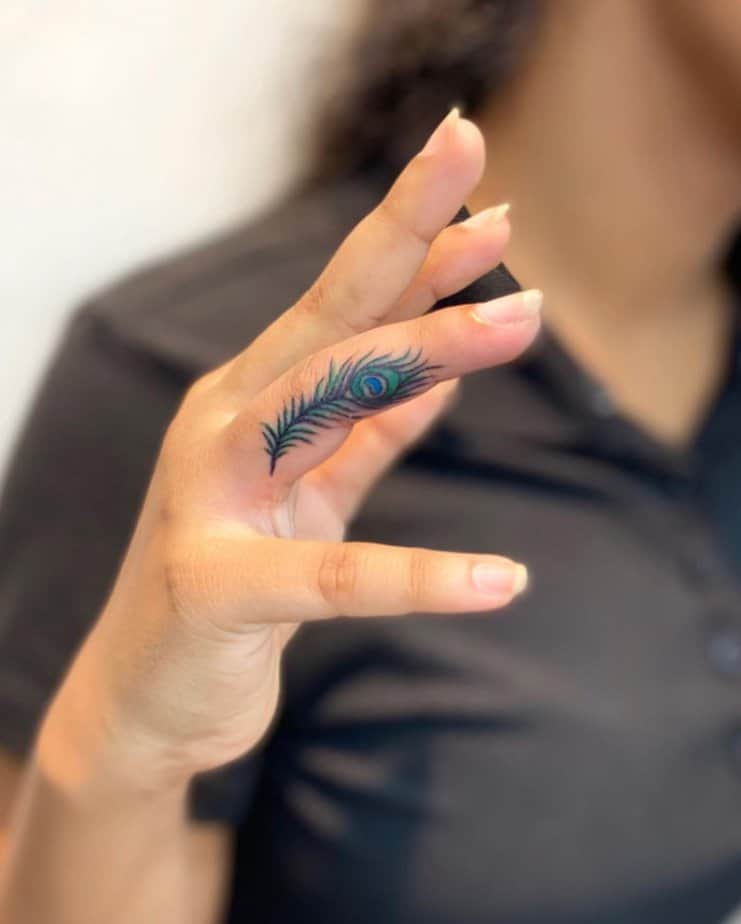 16. Unique peacock feather tattoo design