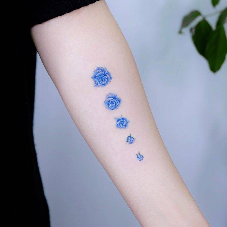 Blooming blue rose tattoo