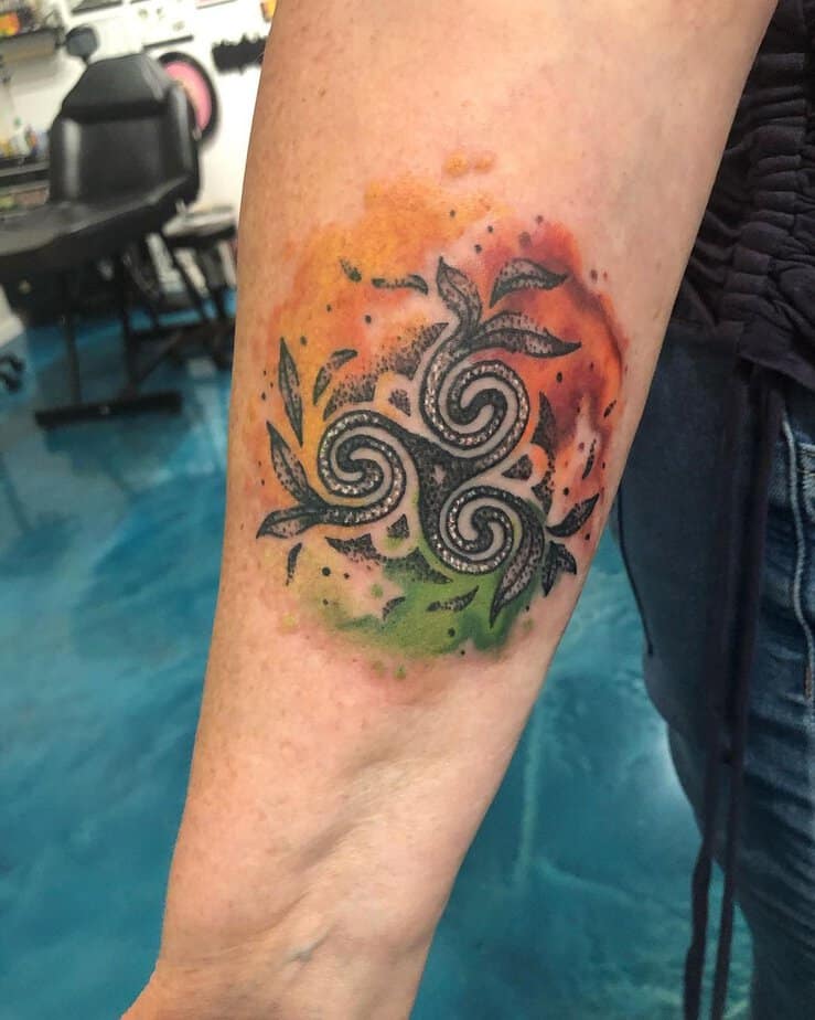 Colorful triskelion tattoo