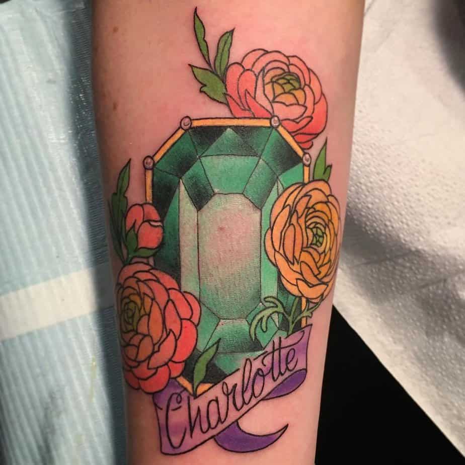 Emerald tattoo with lettering