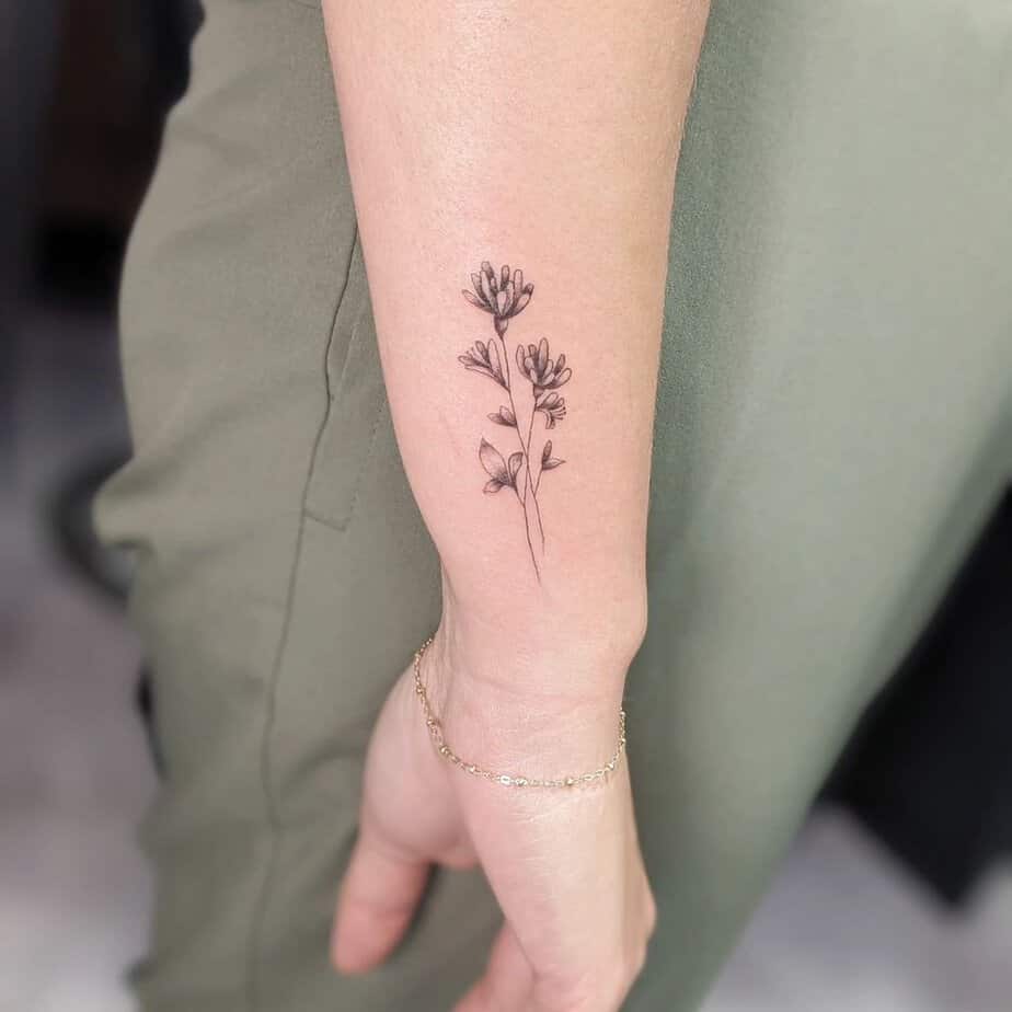 Fine line honeysuckle tattoo