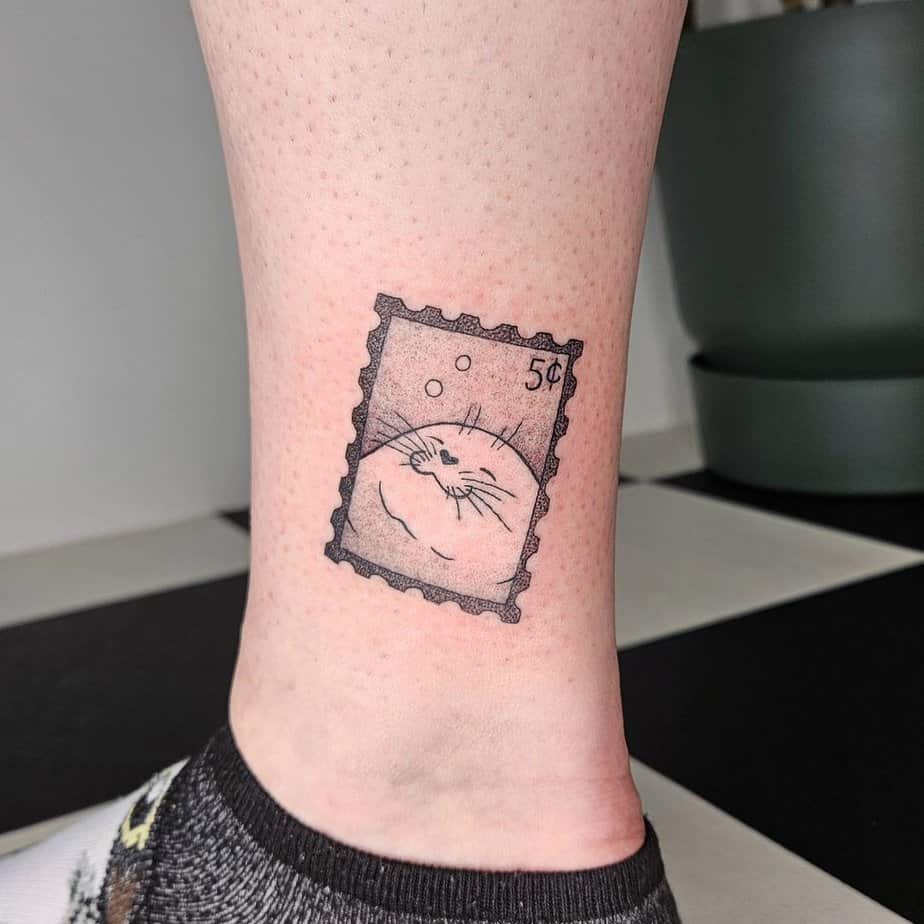 20 Lighthearted Stamp Tattoo Ideas For All The Dreamers Out There