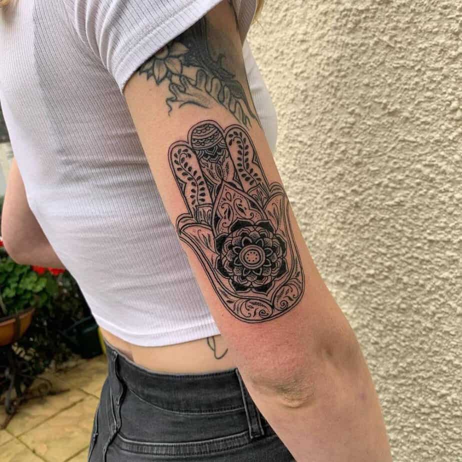 10. Bold and detailed hamsa hand on the arm