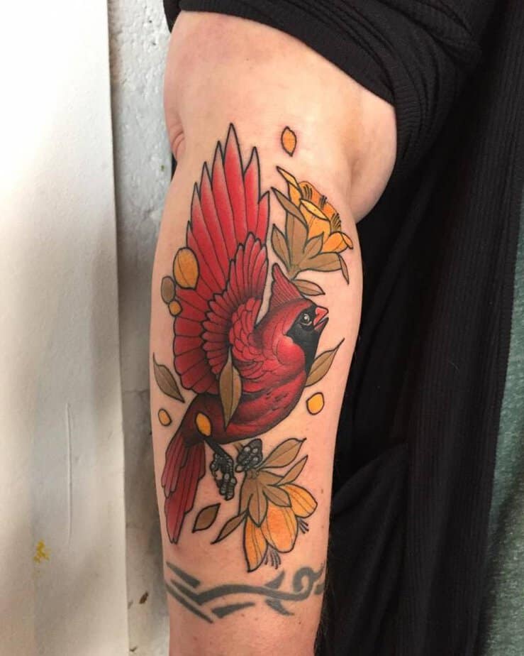 10. Flying cardinal with floral accents